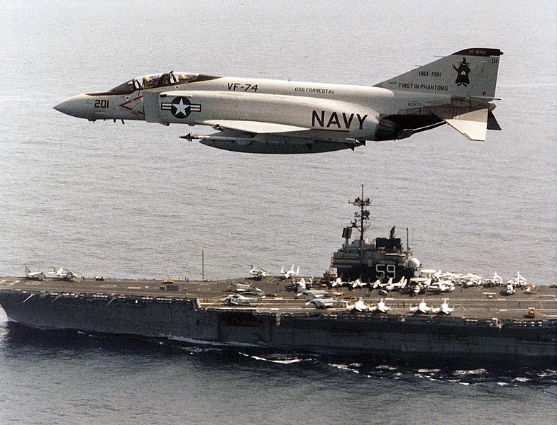 F-4J Phantom II of VF-74 in flight over USS Forrestal 1981