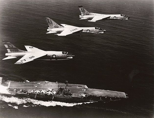 F8 Crusaders fly over USS Forrestal in 1962