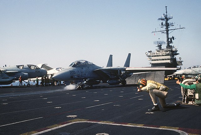 USS America prepares to launch a F-14 Tomcat off the coast of Libya in 1986