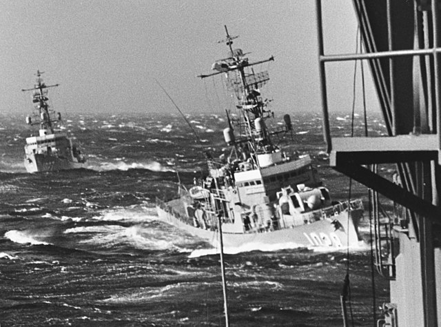 USS John Willis (DE-1027) and USS Van Voorhis (DE-1028) underway off Argentinia in October 1965, seen from Norfolk's prow