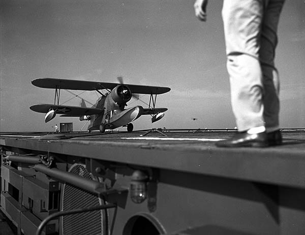 J2F-4_Duck_landing_on_USS_Charger_2_August_1942