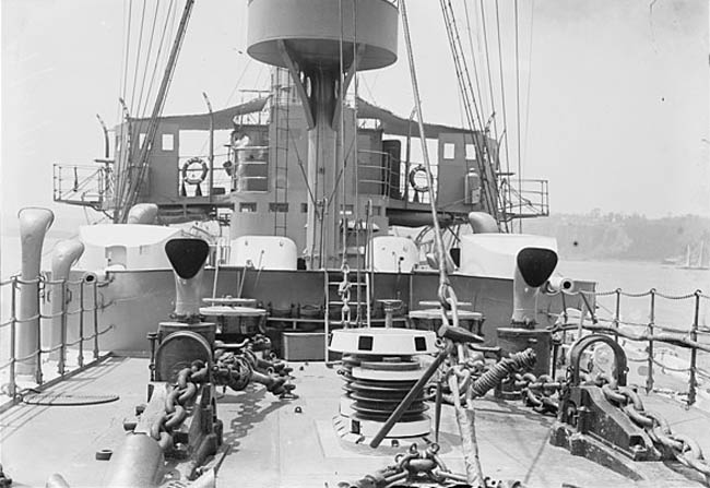 Amidship main deck gun being operated