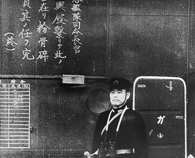 Commanding Officer on IJN Shokaku watches as planes takes off to attack Pearl Harbor