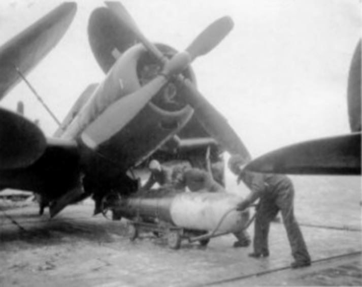 SB2C-4E loads a torpedo (VT-74) onboard CVB-41, 1946