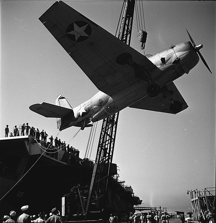 TBF being hoisted aboard USS Santee