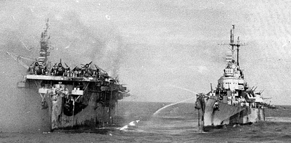 USS Birmingham comes alongside the burning USS Princeton